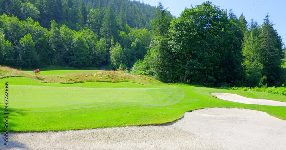 Establishing shot of golf course with gorgeous green and fantastic forest view in Vancouver, Canada, North America. Day time on May 2021. Still camera. ProRes 422 HQ. Establishing shot of golf course with gorgeous green and fantastic forest view in Vancouver, Canada, North America. Day time on May 2021. Still camera. ProRes 422 HQ.