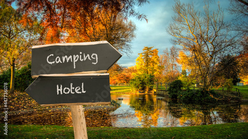 Street Sign to Camping versus Hotel