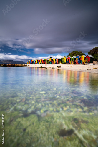 View of St. James tidal pool with colourful summer huts along the beach in Kalk Bay, Cape Town, South Africa. photo