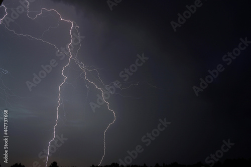 Lightning pierces the air during a thunderstorm.