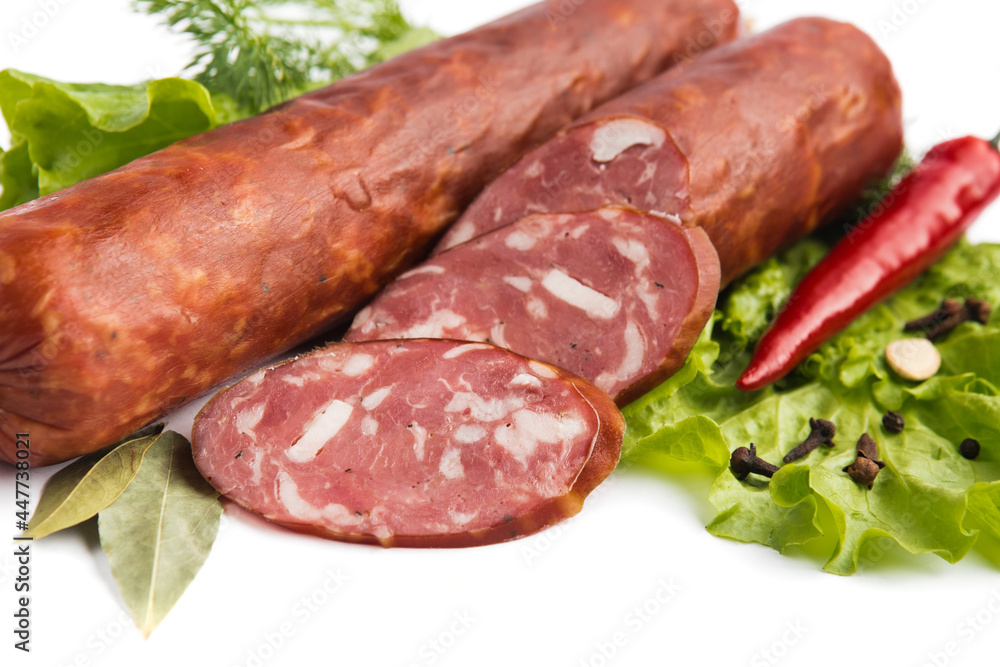 dry-cured salami sausage on a white plate dry-cured salami sausage on a white plate