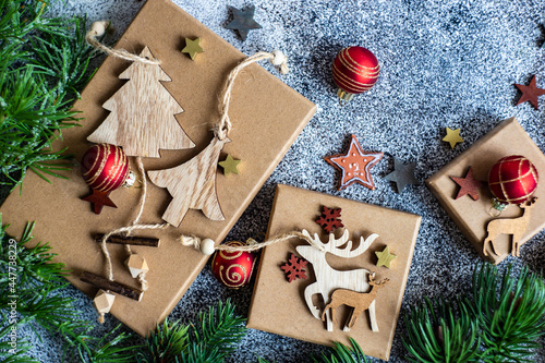 Overhead view of wooden Christmas decorations and gift boxes photo