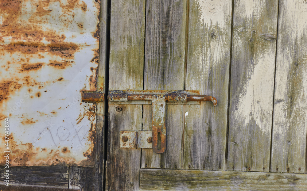 Old rusty latch. Detail of an old rusty latch. Old rusty latch. Detail of an old rusty latch.