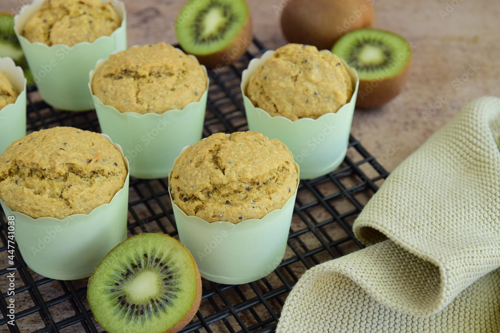 Homemade kiwi muffins on cooling rack Homemade kiwi muffins on cooling rack
