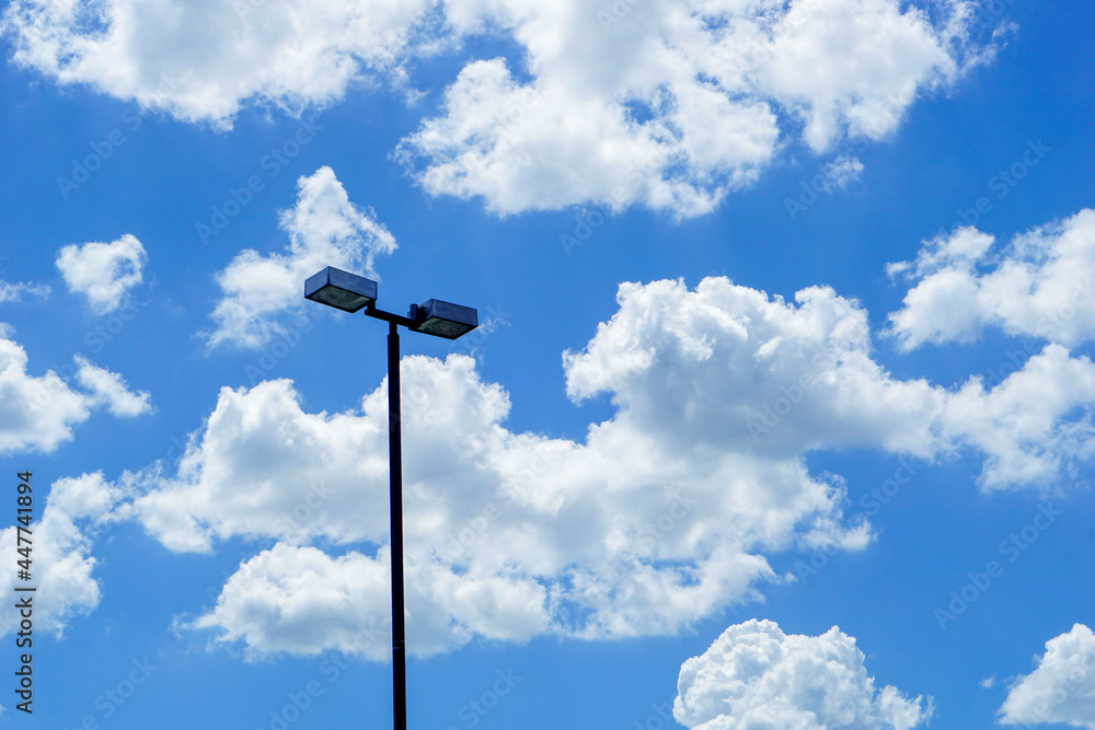 black lamppost against blue sky black lamppost against blue sky