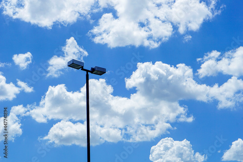 black lamppost against blue sky