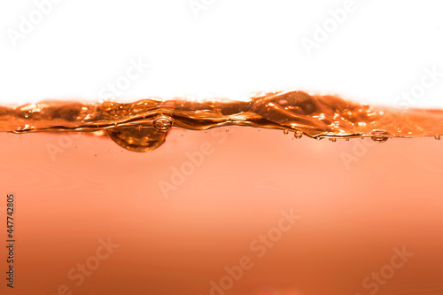 orange clean water with water drops and waves