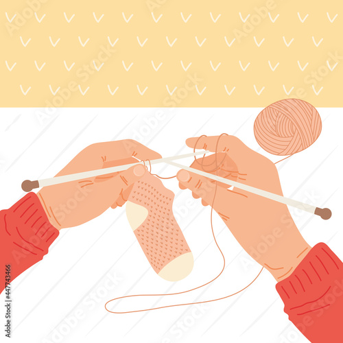Hands holdigng knitted sock