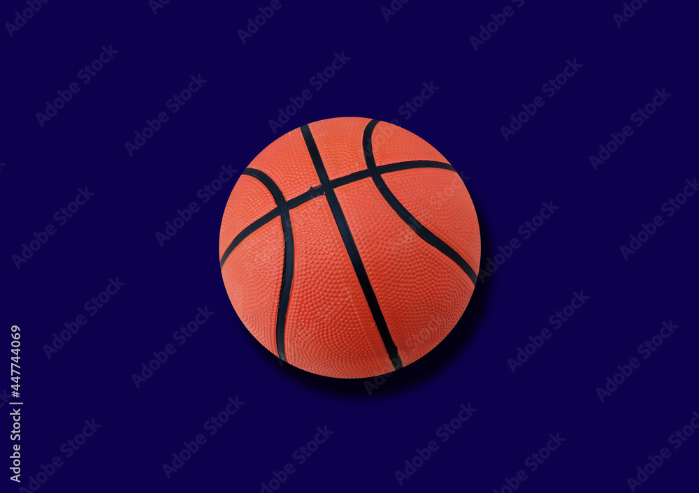 Single new basketball isolated on blue background for stock photo, match play, team, sport equipment