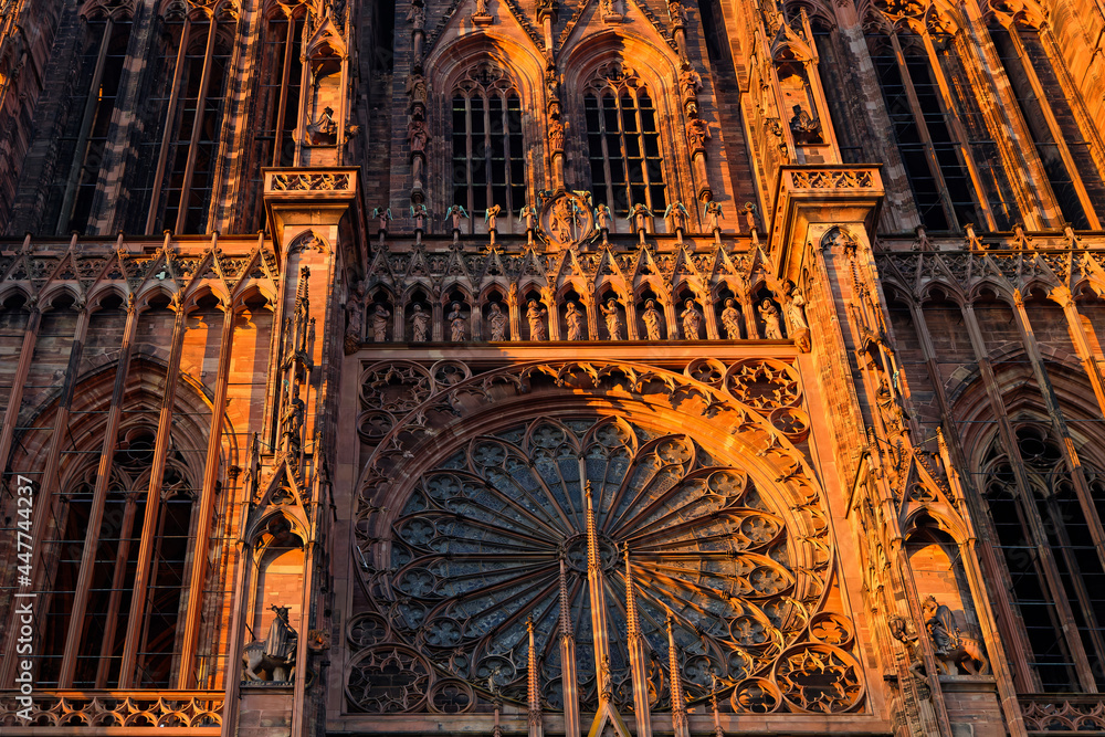 STRASBOURG, FRANCE, June 23, 2021 : Strasbourg Cathedral in the sunset light. The reddish-brown sandstone from the Vosges mountains gives the cathedral its distinctive colour