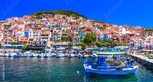 Traditional colorful Greece - charming Plomaripn town. Fishing boats in the port, Lesvos island, Eastern Sporades