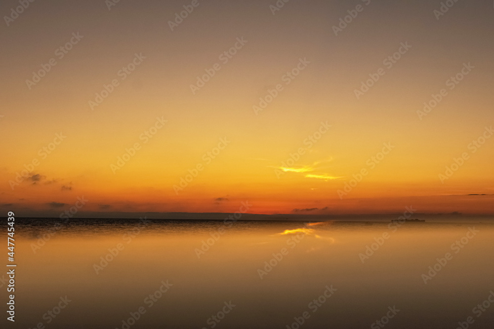 Sunset on the sea in cloudy weather. Nature background