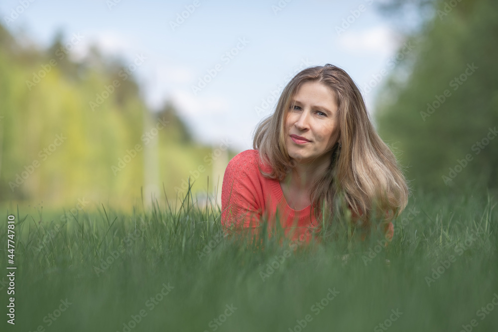 Portrait of a cheerful young blonde girl in the park. Portrait of a cheerful young blonde girl in the park.