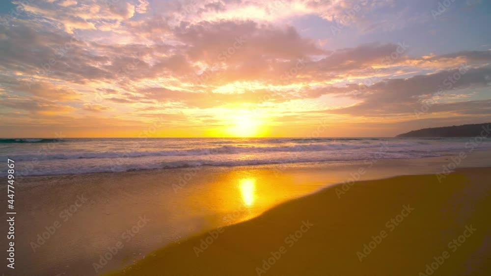 The scenery, beaches, natural beauty and wonders. sunset in the sea On a beautiful day, the sky is golden yellow and the sea waves wash on the beautiful soft sandy beach The scenery, beaches, natural beauty and wonders. sunset in the sea On a beautiful day, the sky is golden yellow and the sea waves wash on the beautiful soft sandy beach