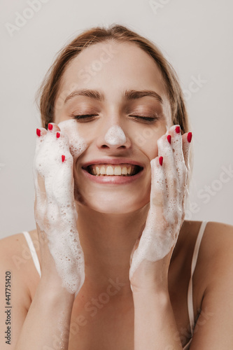 Photography Excited young blonde washing face