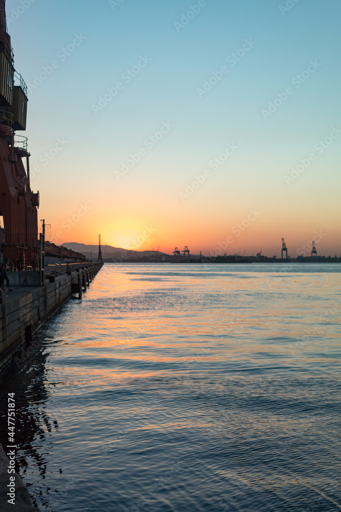 Naklejka premium sunset in a seaport
