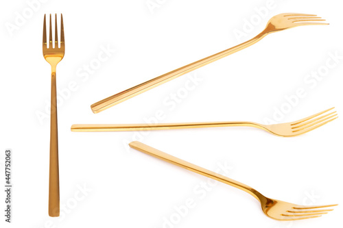 fork brass gold isolated on white background photo