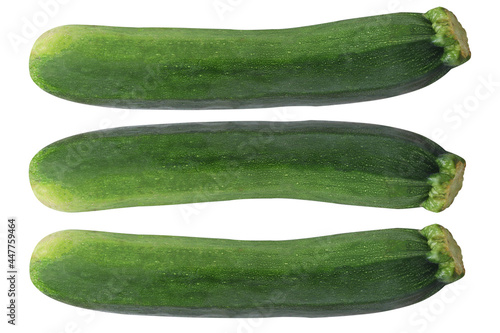 Three fresh zucchini on isolated white background