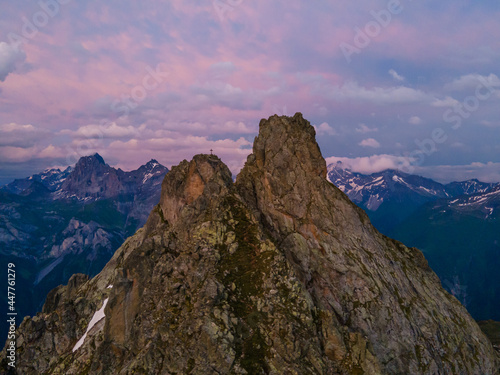 Aerial View of two peaks with a cross in evening light in Uri, Switzerland photo