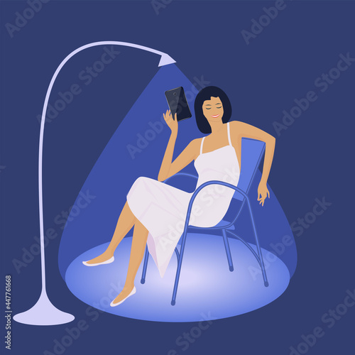 A woman in a nightgown sits on a chair, cheerful communication through a smartphone, a floor lamp - vector. Passing time at night, late in the evening. Internet addiction. Doom scroll.