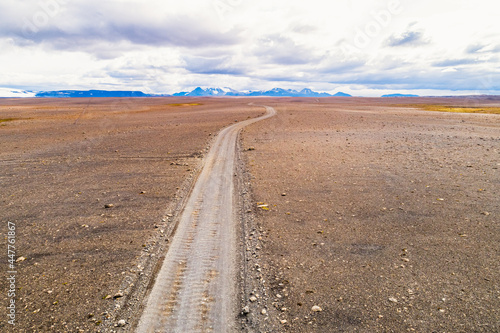 Aerial view of Kjolur 4WD road through desolate landscape in highlands, Iceland photo