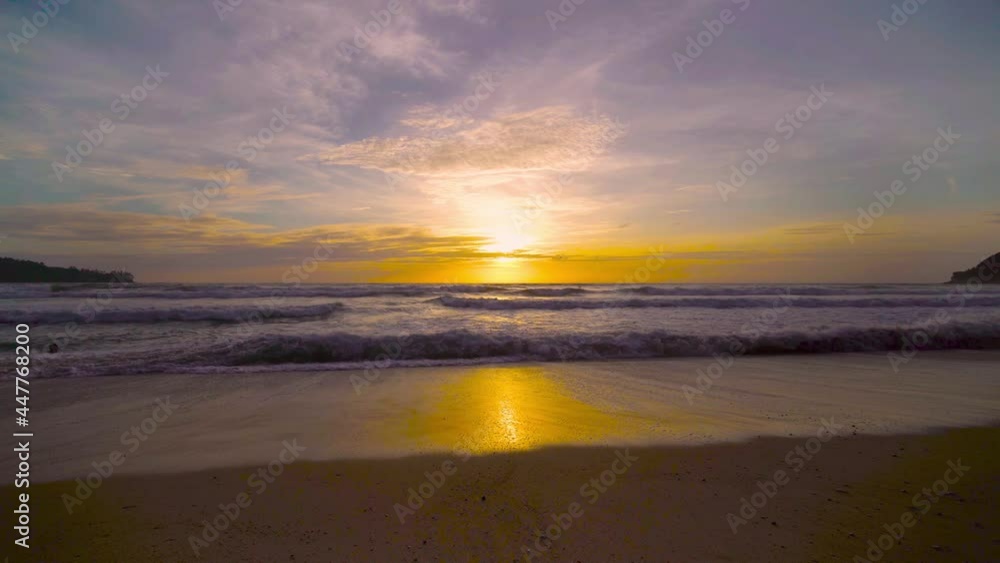 The scenery, beaches, natural beauty and wonders. sunset in the sea On a beautiful day, the sky is golden yellow and the sea waves wash on the beautiful soft sandy beach The scenery, beaches, natural beauty and wonders. sunset in the sea On a beautiful day, the sky is golden yellow and the sea waves wash on the beautiful soft sandy beach