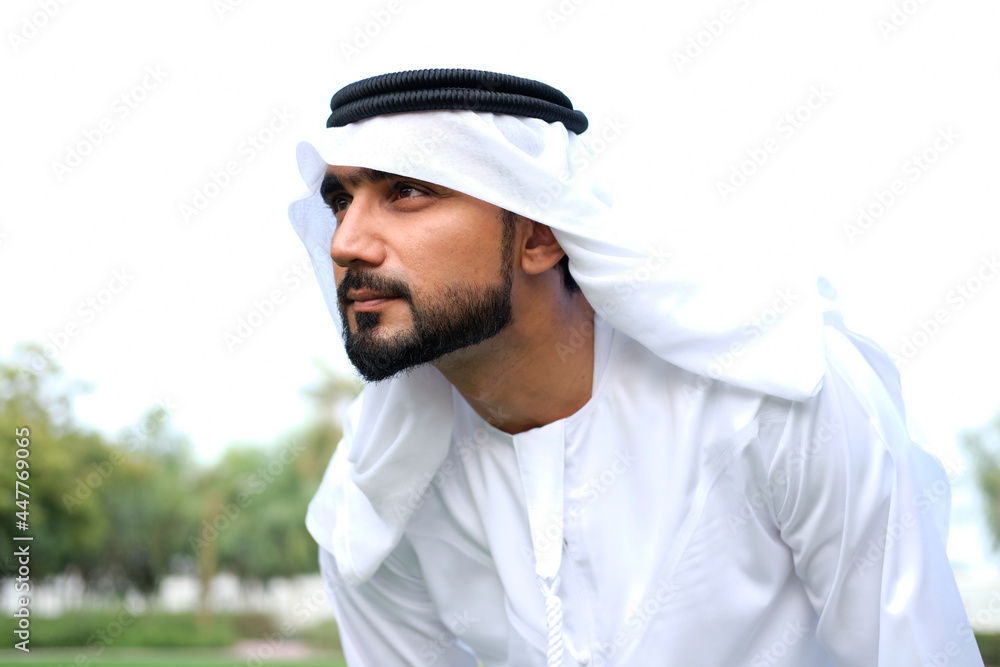 Arab Emirati man on kandura. Portrait of Arabic guy Arab Emirati man on kandura. Portrait of Arabic guy
