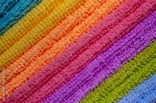 A stack of colored microfiber napkins. Row of diagonal colorful microfiber towels. Full frame