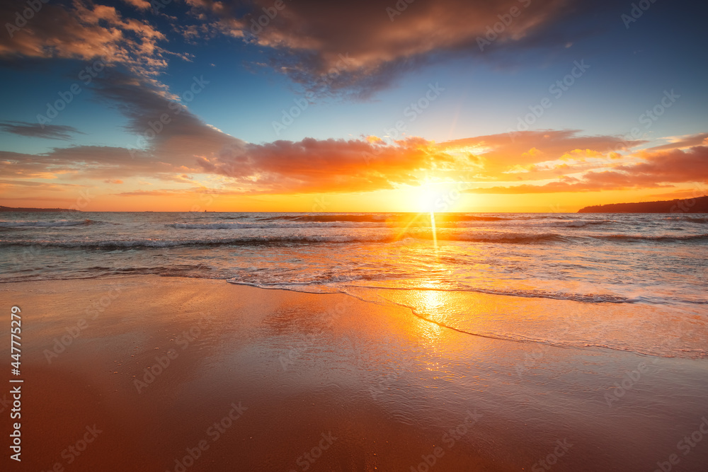 Beach sunrise over the tropical sea