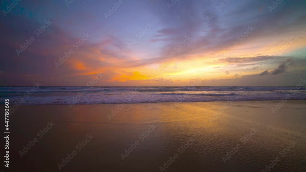 The scenery, beaches, natural beauty and wonders. sunset in the sea On a beautiful day, the sky is golden yellow and the sea waves wash on the beautiful soft sandy beach The scenery, beaches, natural beauty and wonders. sunset in the sea On a beautiful day, the sky is golden yellow and the sea waves wash on the beautiful soft sandy beach