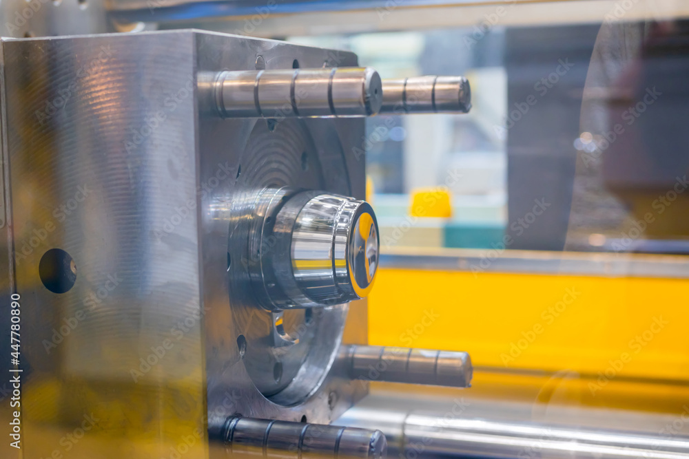 Mold plates - part of automatic injection molding machine at exhibition, trade show. Manufacturing, production, technology concept Mold plates - part of automatic injection molding machine at exhibition, trade show. Manufacturing, production, technology concept