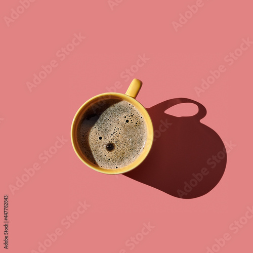 Top view of a cup of coffee on pink  pastel background © Vaceslav Romanov