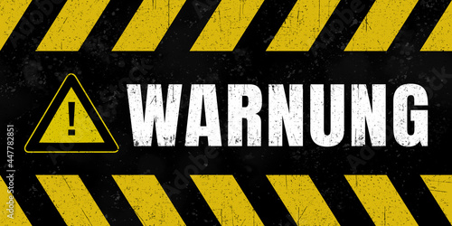 Schild im Grungelook mit Text: „Warnung"