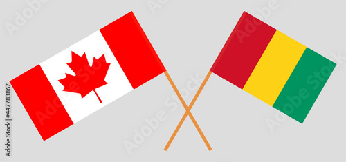 Crossed flags of Canada and Guinea. Official colors. Correct proportion