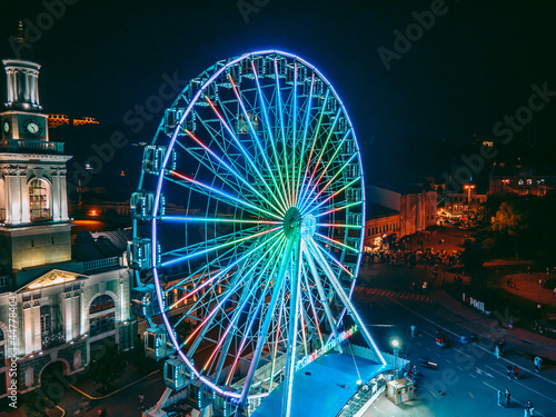 Aerial view from drone ferris wheel in city at night