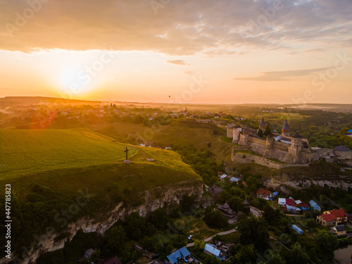 Aerial drone view of a medieval castle among the hills in summer