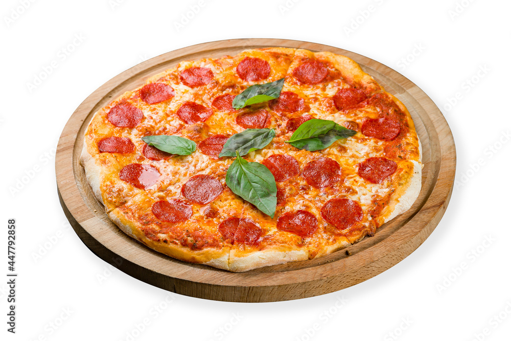 Pepperoni pizza with basil on wooden board isolated on white