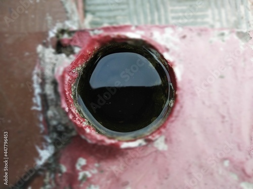 Water in a pipe in blur background. Water in a cup in blur background.