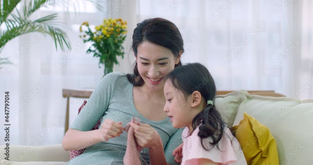 Happy mother and daughter knitting at home,4K Happy mother and daughter knitting at home,4K