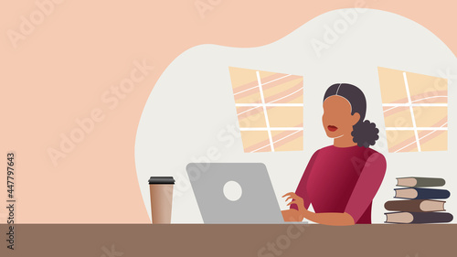 Young Latina  woman using laptop at home or office. Education or office work concept. Table with books and takeout cup of coffee
