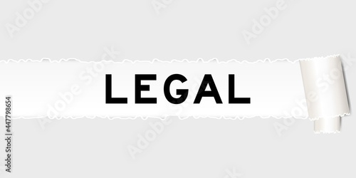 Ripped gray paper that have word legal under torned part