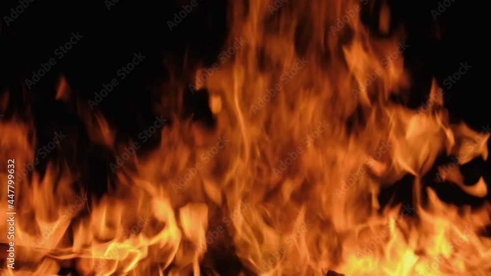 Slow motion burning bonfire. Close-up shot of warm cozy burning fire. Slow motion. HD Slow motion burning bonfire. Close-up shot of warm cozy burning fire. Slow motion. HD
