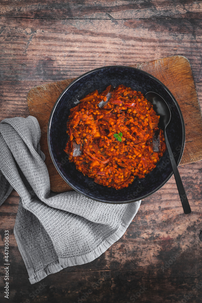 vegan vegan eggplant lentil curry with tomato sauce and cilantro, healthy plant-based food