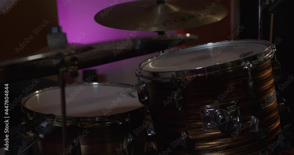 Close Up of Drumming in Studio with Moody Lighting Close Up of Drumming in Studio with Moody Lighting
