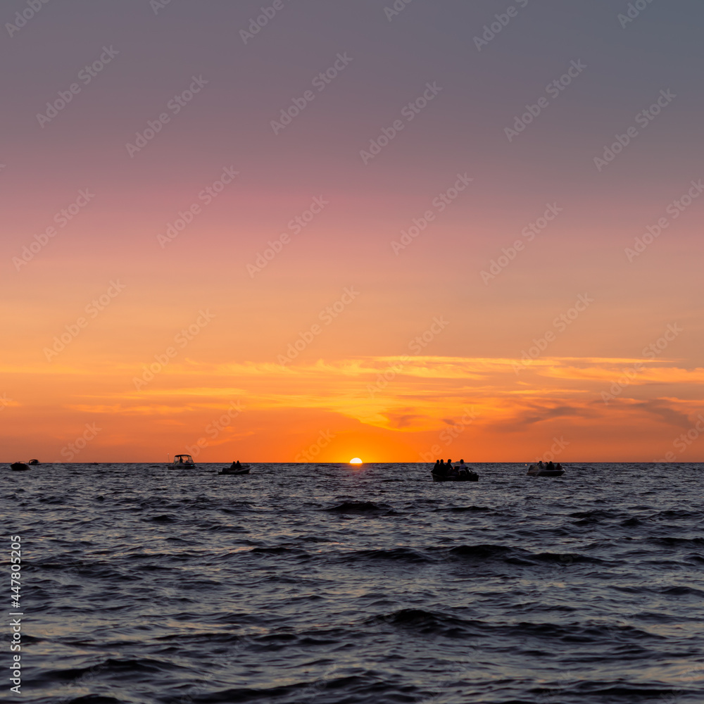 sunset over the sea, lake sunset, boats on the water, orange sunset