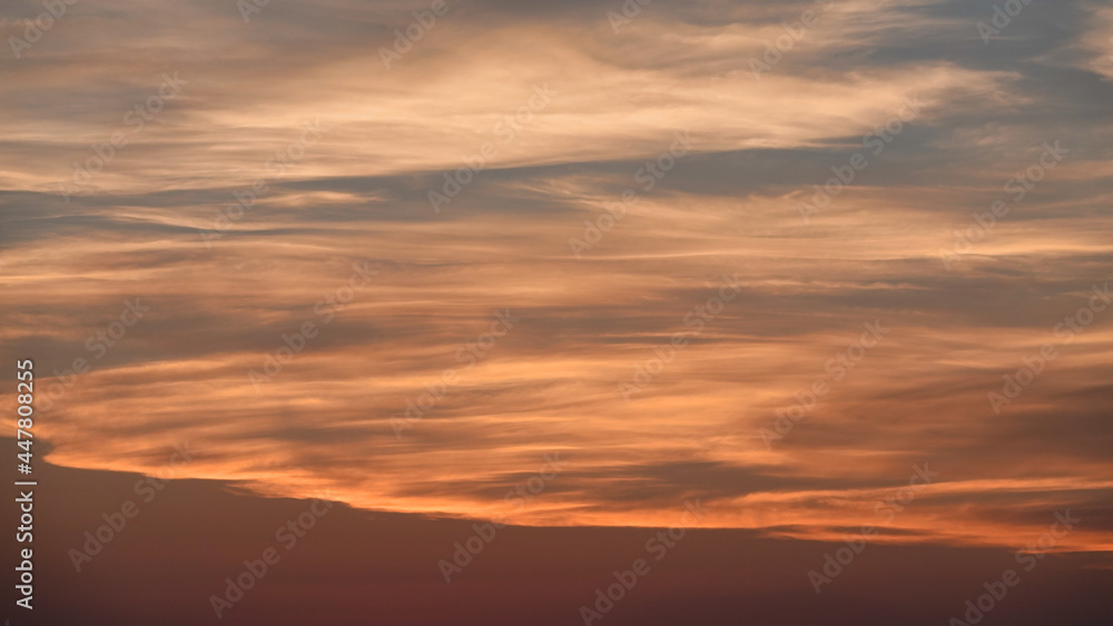 Sky and sunset in blue, white, red, pink tones over mountain . Color swatch of sunset colors mixed together