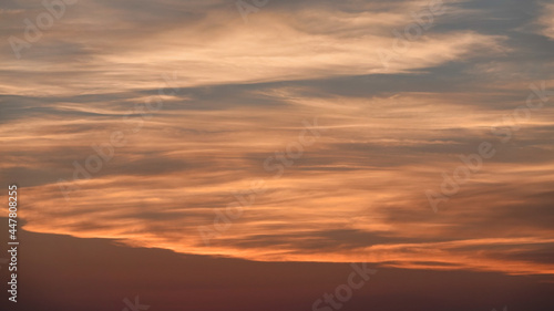 Sky and sunset in blue, white, red, pink tones over mountain . Color swatch of sunset colors mixed together