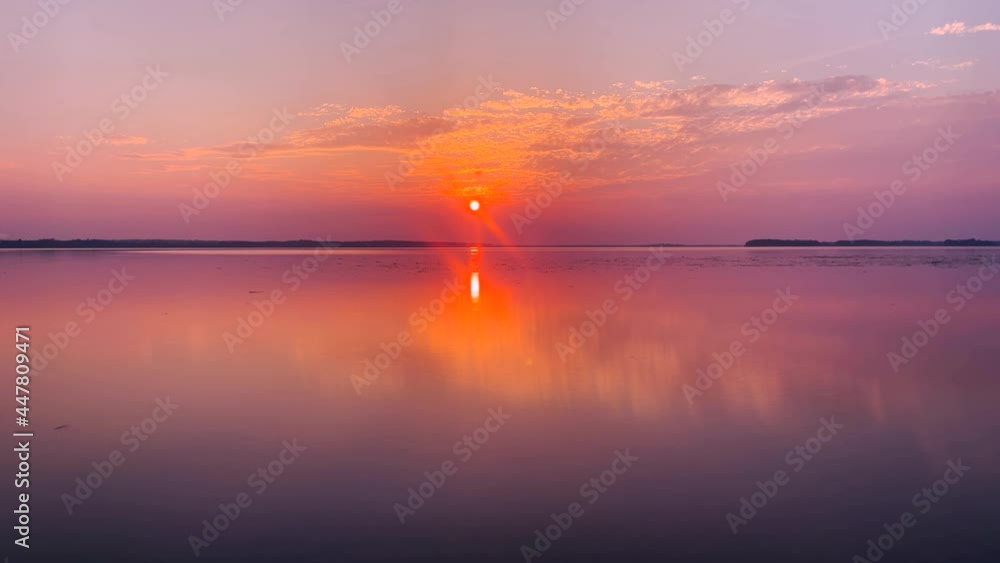 Golden Vivid Colorful Sunset Time Lapse Reflected On Serene Lake Golden Vivid Colorful Sunset Time Lapse Reflected On Serene Lake
