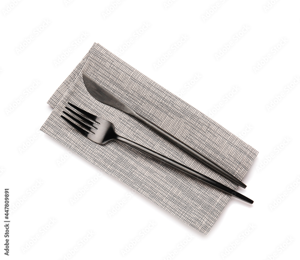 Clean napkin and cutlery on white background Clean napkin and cutlery on white background