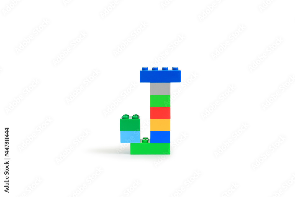 Alphabet letters J from colorful plastic brick block constructor isolated on white background. Image with Clipping path Alphabet letters J from colorful plastic brick block constructor isolated on white background. Image with Clipping path